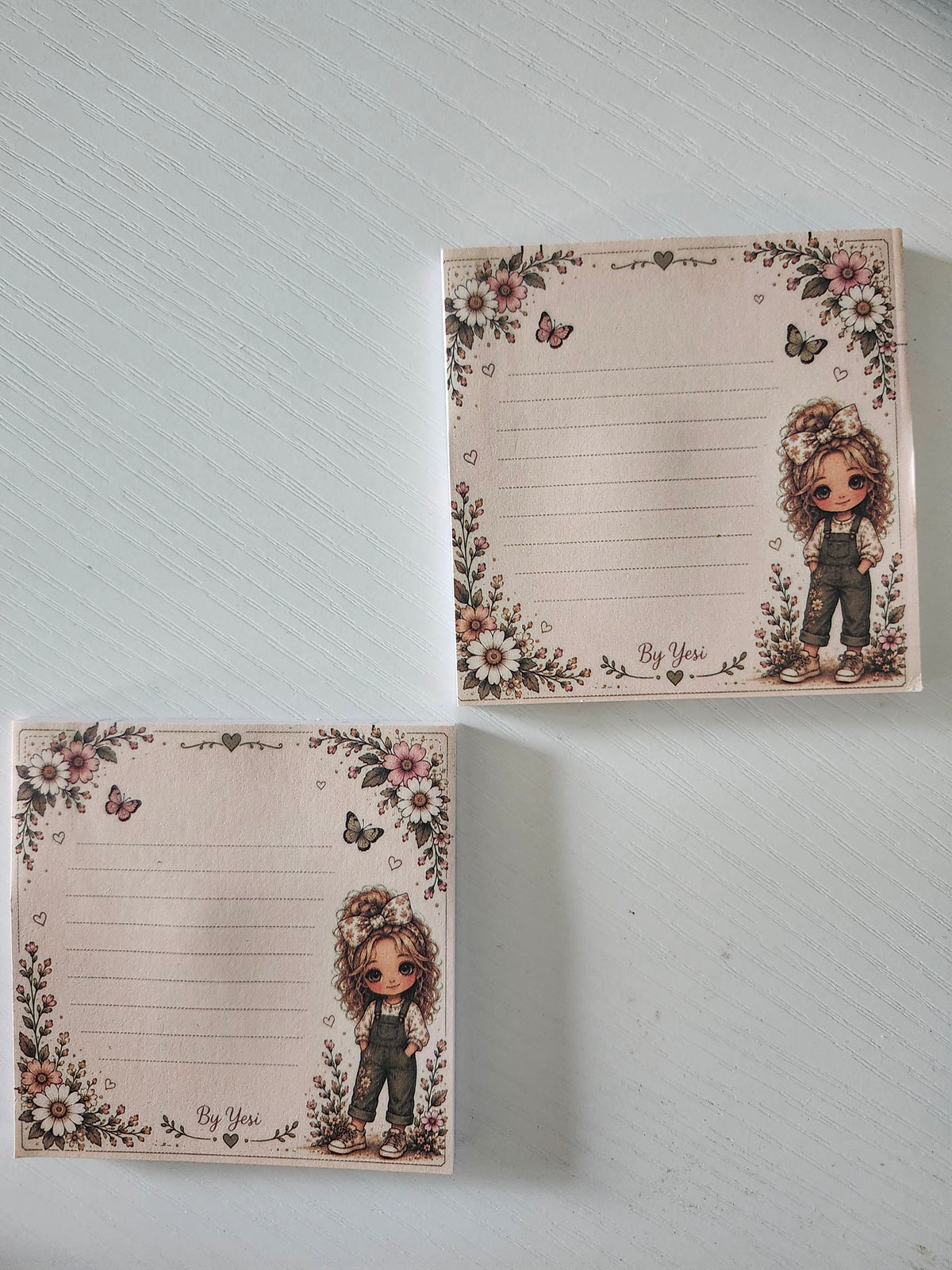 Yesi's Whimsical Girls die-cut sticker sheet with 3 whimsical girl stickers in different poses with wildflowers